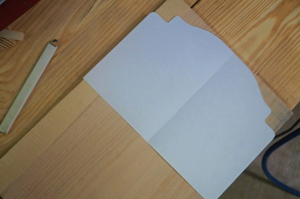 White pattern paper laying on board 