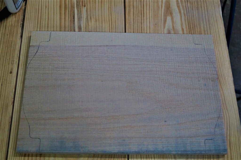 16 inch x 11 inch board with design drawn on each end