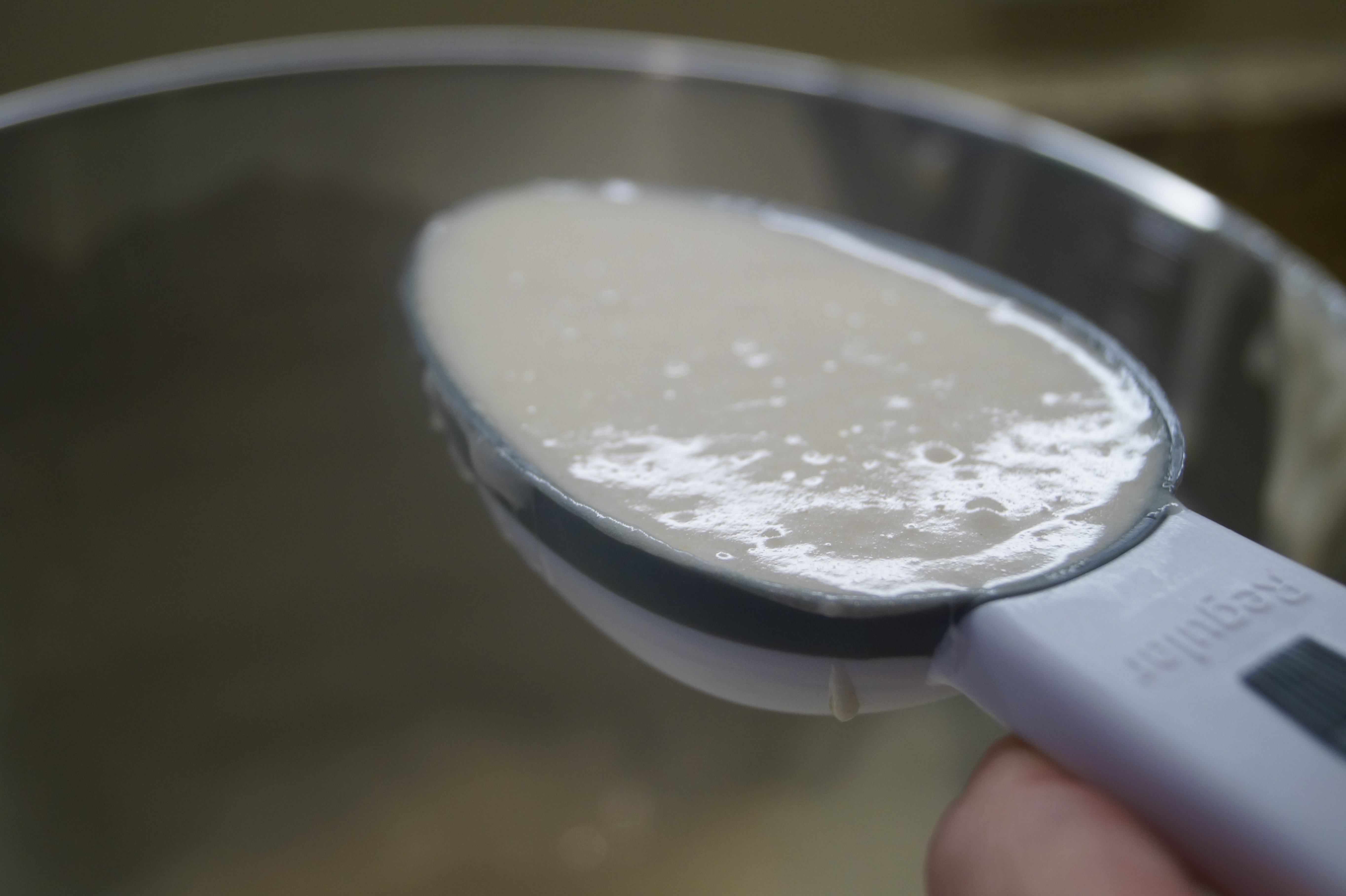 cupcake batter measuring scoop filled with cupcake batter for cupcake pull apart cake 