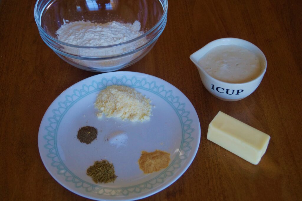 Ingredients for rosemary sourdough crackers displayed 