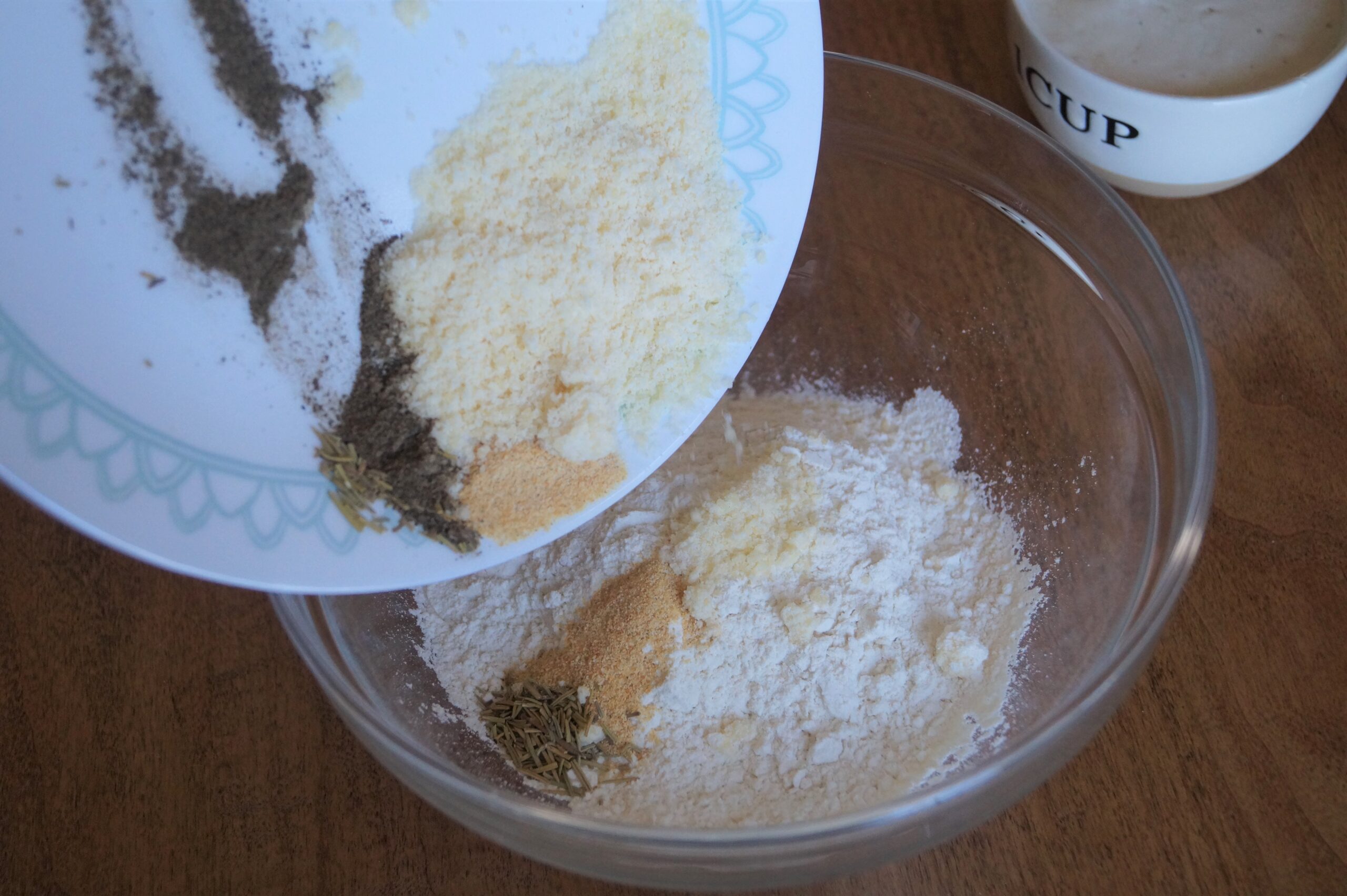 mixing dry ingredients for rosemary parmesan sourdough crackers 