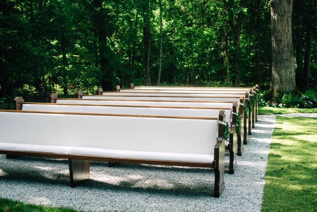 outdoor wedding with church pews 