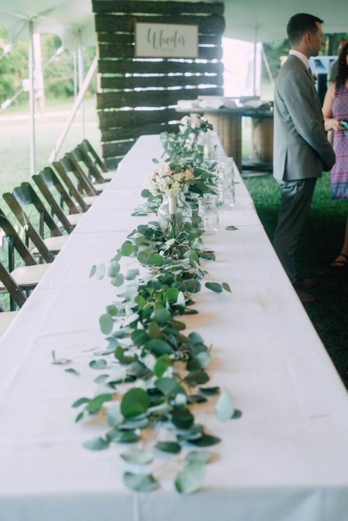 wedding party table with eucalyptus runner