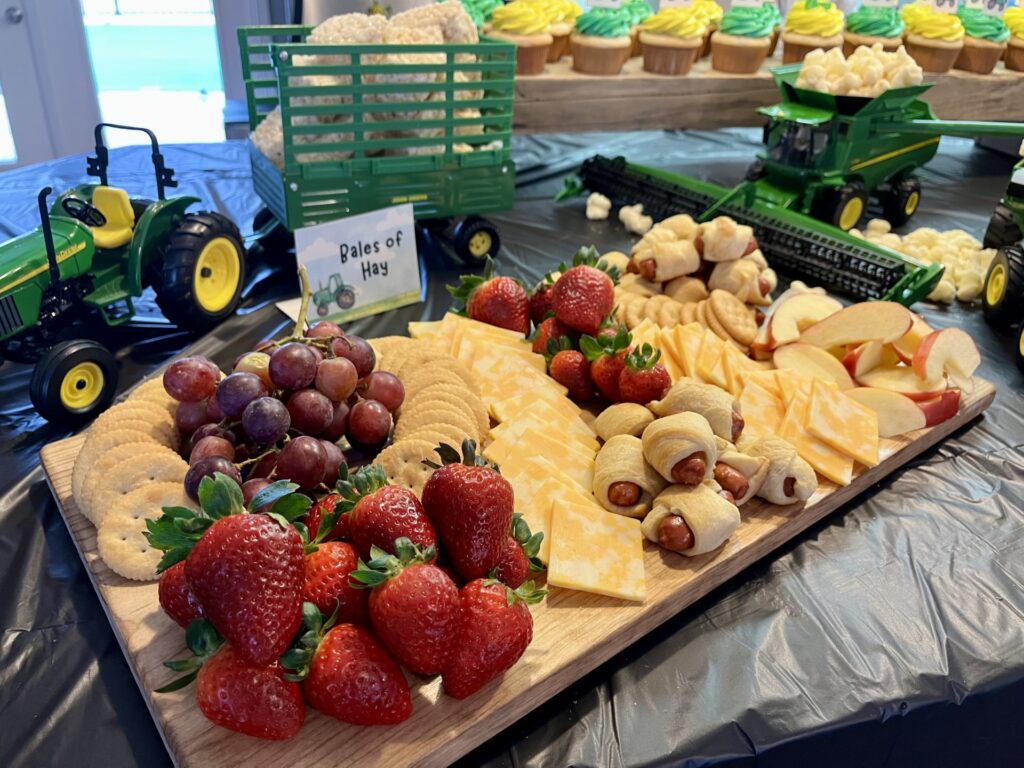 fruit, cheese, and crackers on charcuterie board 