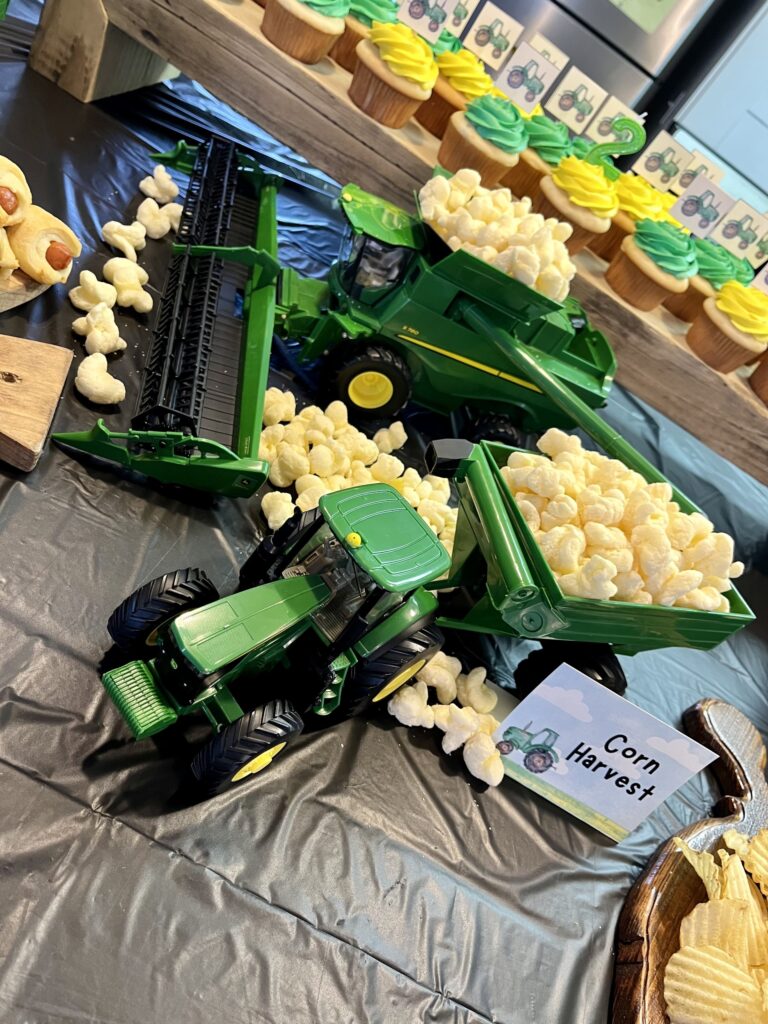 john deere combine, tractor, and grain cart hauling puff corn 