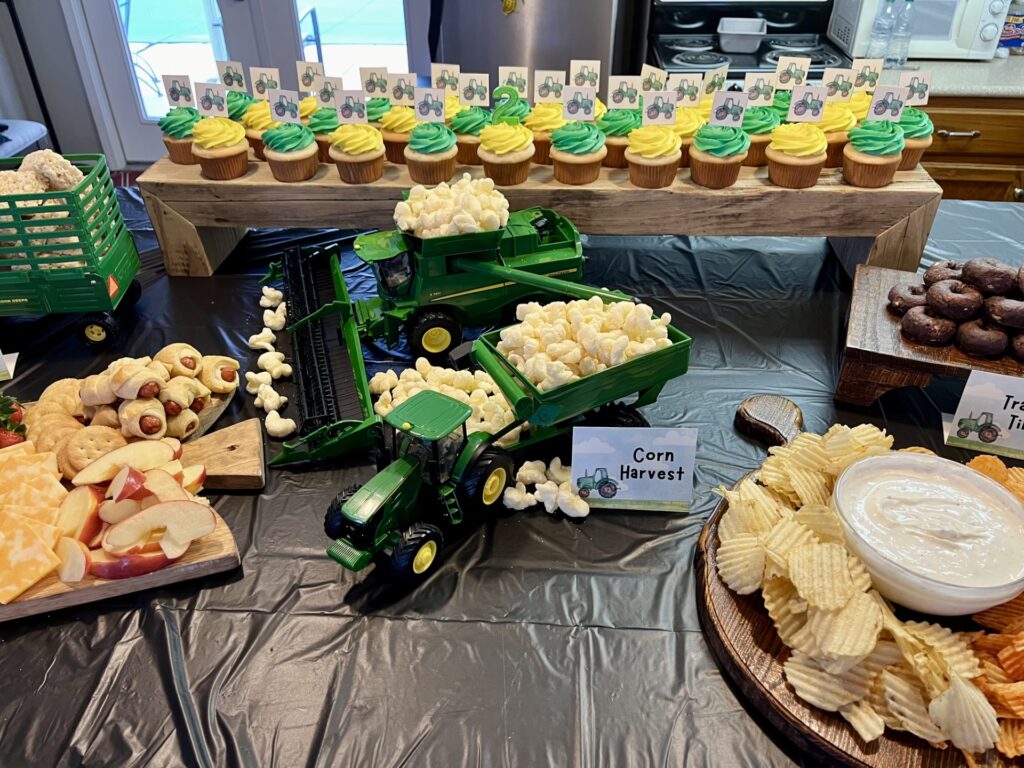 green and yellow cupcakes on wooden riser 